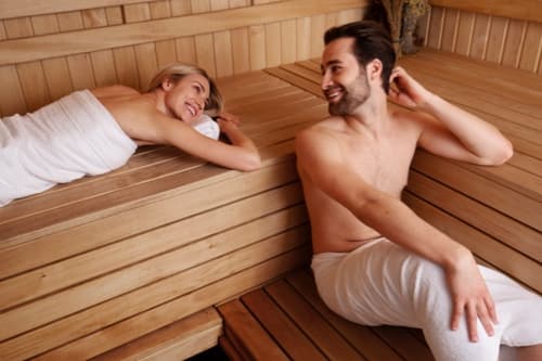 Couple relaxing in the sauna at Superior Stay Hotel